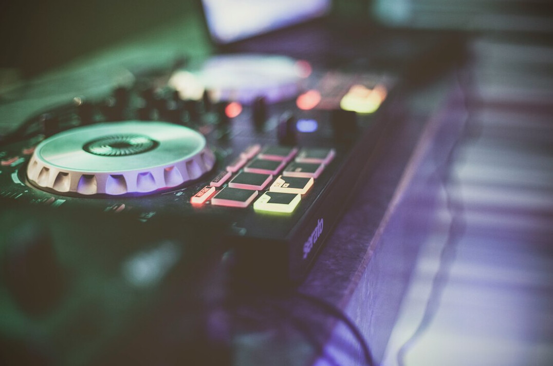Audio mixing console with faders in a broadcast control room