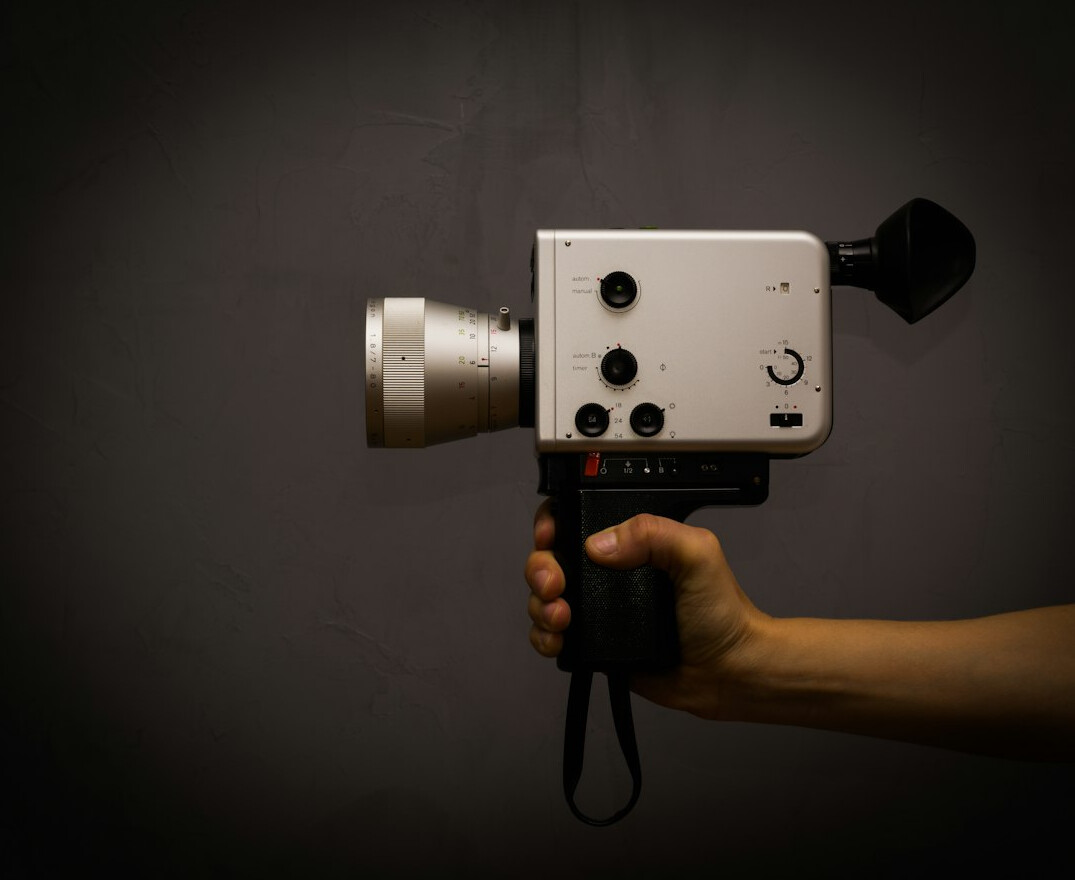 Broadcast camera on a pedestal in a television news studio